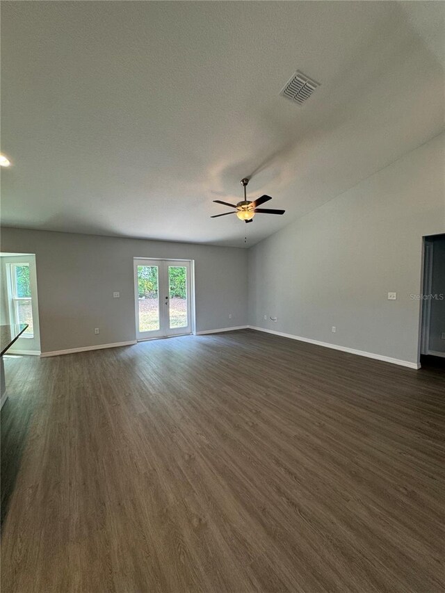 7051 SW 64th Ter, Ocala, FL 34476 - unfurnished living room with dark wood finished floors, visible vents, a ceiling fan, and baseboards