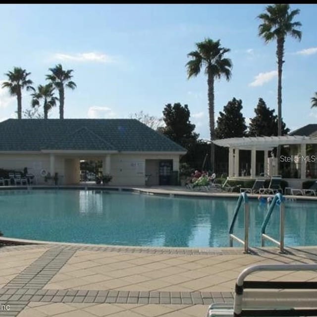 view of swimming pool featuring a patio