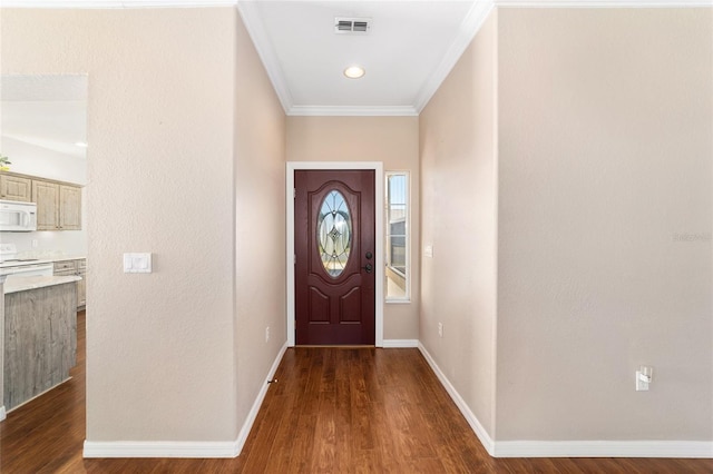 entryway with hardwood / wood-style flooring and ornamental molding