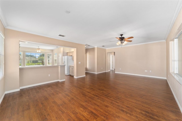 empty room featuring dark hardwood / wood-style flooring, ceiling fan, and ornamental molding