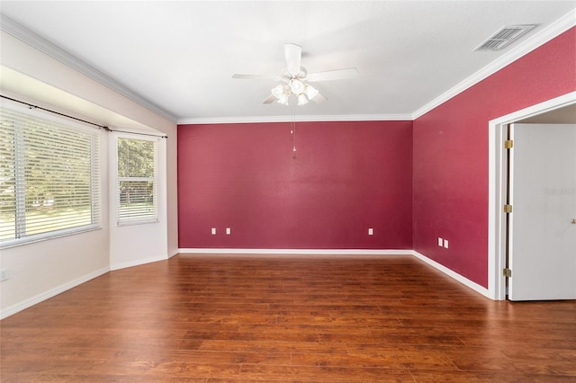 unfurnished room featuring ceiling fan, dark hardwood / wood-style flooring, and ornamental molding