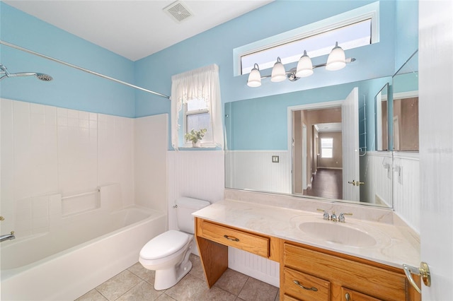 full bathroom with tile patterned flooring, vanity, bathing tub / shower combination, and toilet