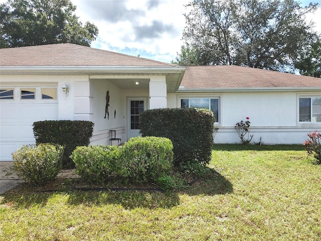 5958 SW 102nd Ln, Ocala, FL 34476 - view of front of house with a front yard and a garage
