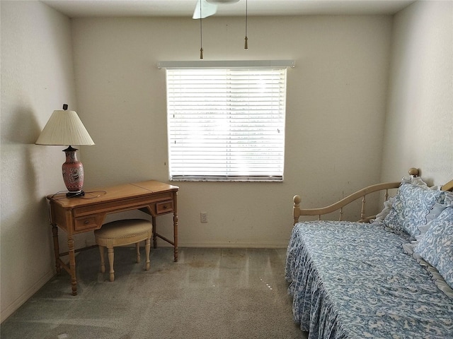 bedroom with dark colored carpet and ceiling fan