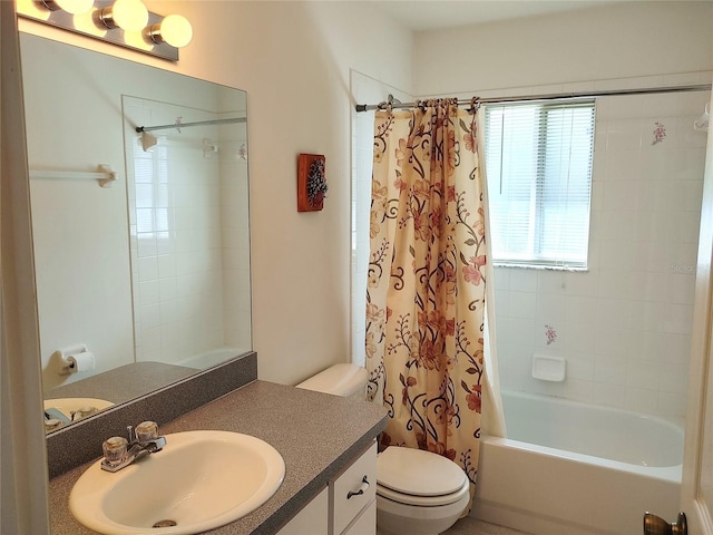 full bathroom featuring shower / tub combo, large vanity, and toilet