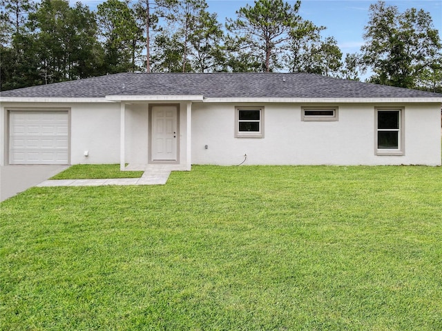 ranch-style house with a front lawn and a garage