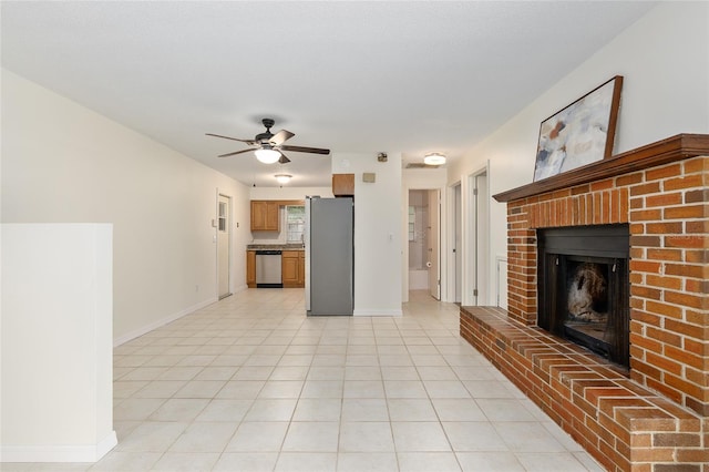 unfurnished living room with ceiling fan and a fireplace