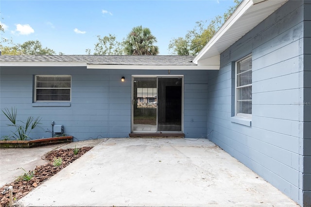 entrance to property with a patio