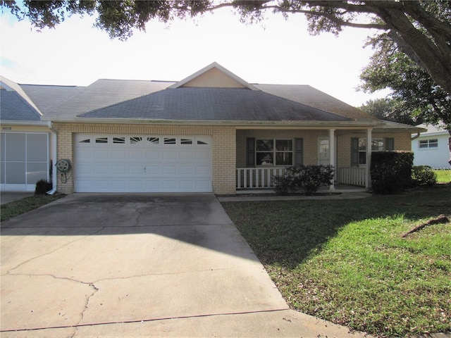 ranch-style home featuring a front yard and a garage