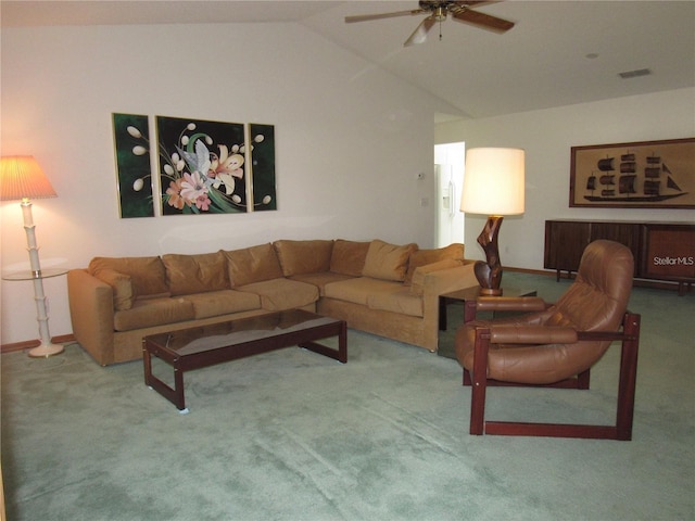 living room with ceiling fan, lofted ceiling, and carpet flooring