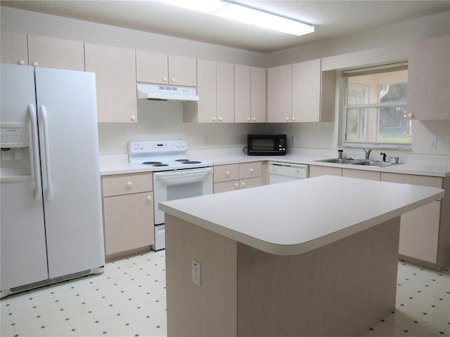 kitchen featuring sink, white appliances, a center island, and light tile floors