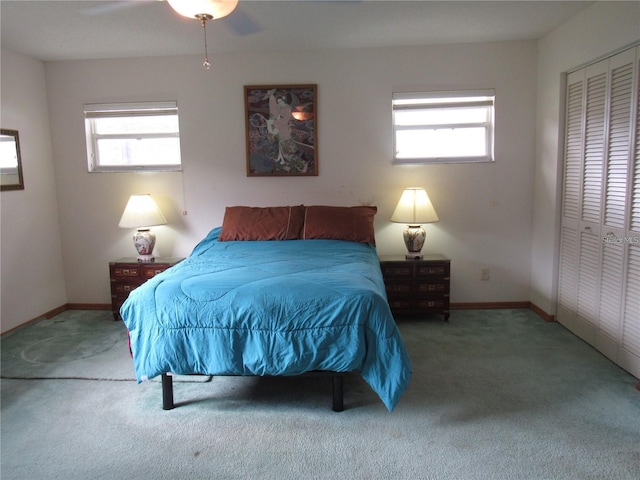 bedroom featuring ceiling fan, carpet, and a closet