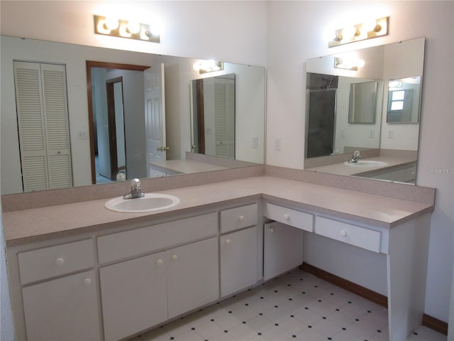 bathroom featuring tile flooring and large vanity