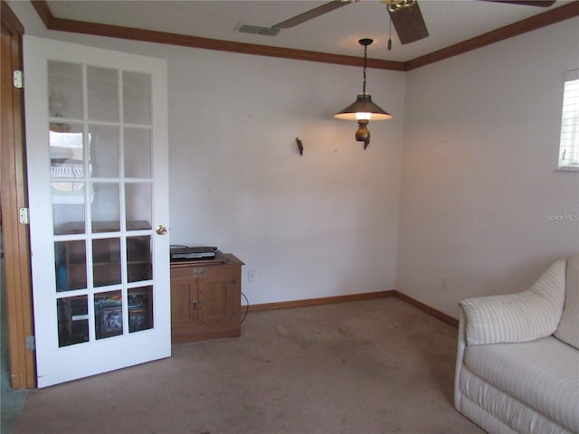 unfurnished room with ceiling fan, carpet floors, and ornamental molding