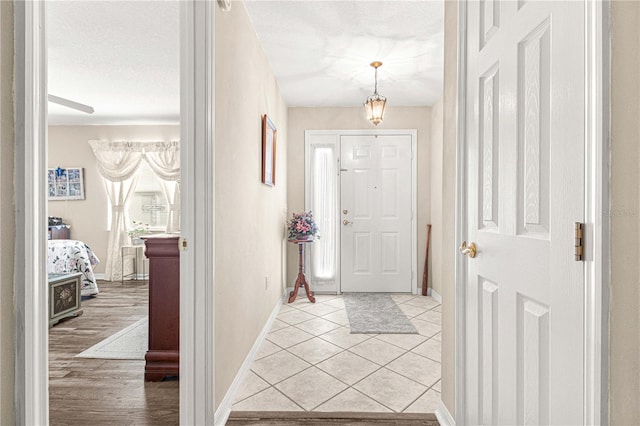 foyer entrance with light hardwood / wood-style flooring