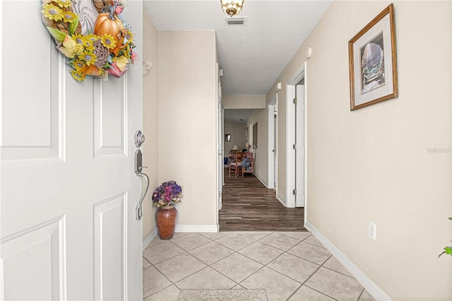 corridor with light tile flooring