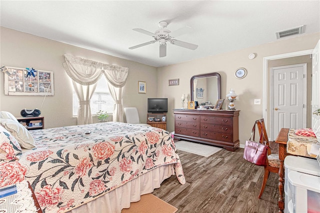 bedroom featuring ceiling fan and dark wood-type flooring