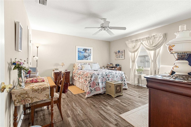 bedroom featuring hardwood / wood-style floors and ceiling fan