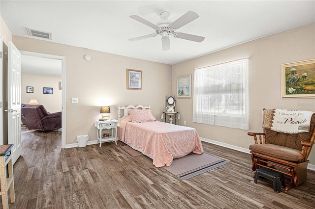 bedroom featuring ceiling fan and dark hardwood / wood-style flooring