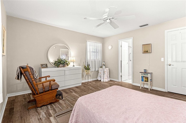 bedroom with ceiling fan and dark wood-type flooring