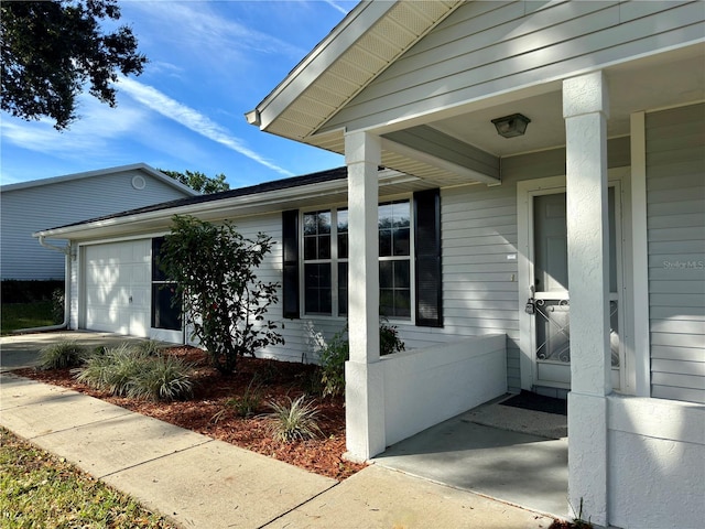 doorway to property featuring a garage