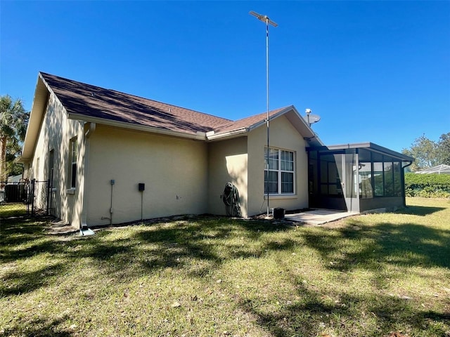 back of house with a yard