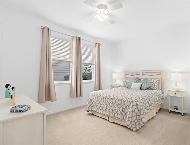 3554 NW 55th Cir, Ocala, FL 34482 - bedroom with light colored carpet, baseboards, and ceiling fan