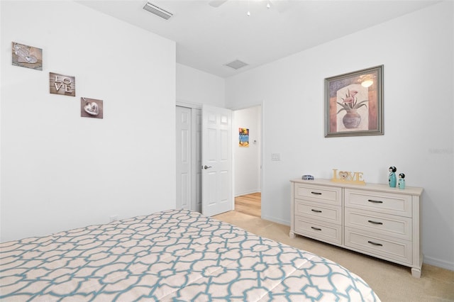 3554 NW 55th Cir, Ocala, FL 34482 - bedroom featuring light carpet, baseboards, a closet, and ceiling fan