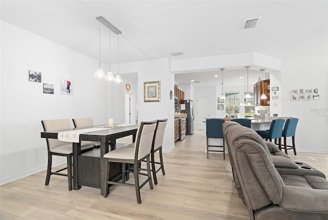 3554 NW 55th Cir, Ocala, FL 34482 - dining room with light wood-type flooring, baseboards, and recessed lighting