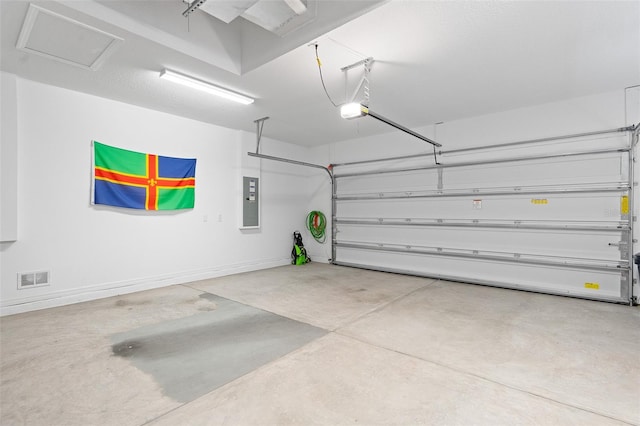 3554 NW 55th Cir, Ocala, FL 34482 - garage featuring electric panel and baseboards