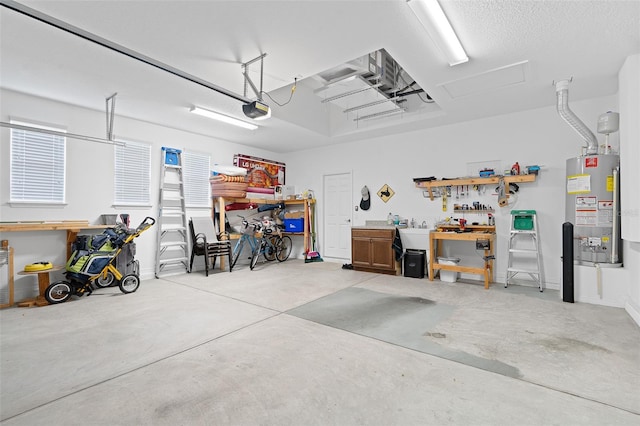 3554 NW 55th Cir, Ocala, FL 34482 - garage with gas water heater, a workshop area, and a garage door opener