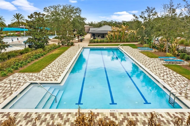 3554 NW 55th Cir, Ocala, FL 34482 - community pool featuring a patio area