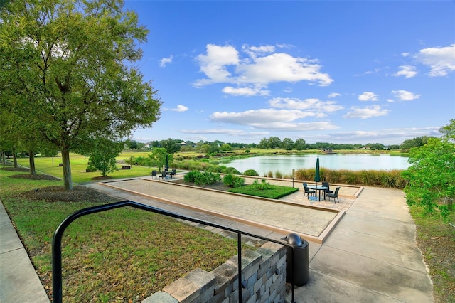 3554 NW 55th Cir, Ocala, FL 34482 - view of community featuring a game area, a water view, and a lawn