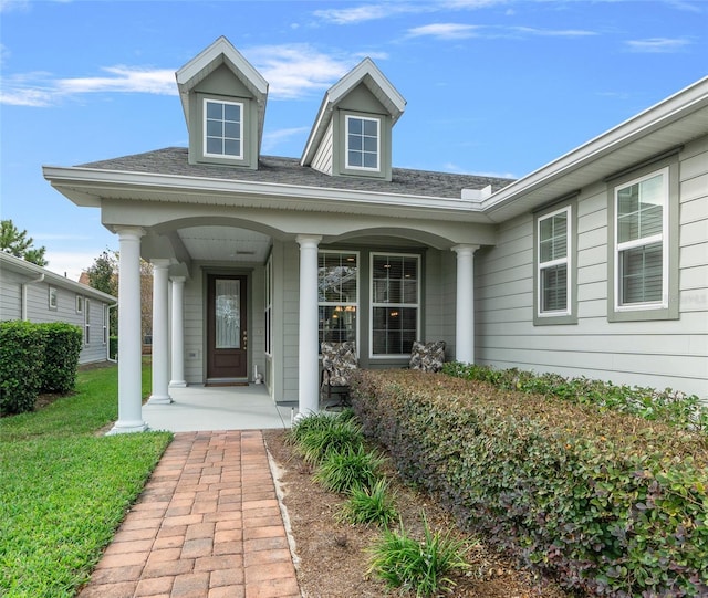 3554 NW 55th Cir, Ocala, FL 34482 - doorway to property featuring covered porch and a yard