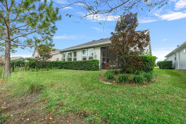 3554 NW 55th Cir, Ocala, FL 34482 - view of home's exterior featuring a yard