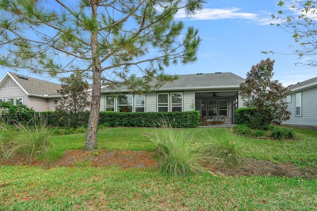3554 NW 55th Cir, Ocala, FL 34482 - rear view of house featuring ceiling fan, a lawn, and a sunroom