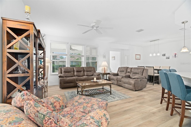 3554 NW 55th Cir, Ocala, FL 34482 - living area featuring ceiling fan and wood finished floors