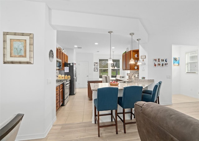 3554 NW 55th Cir, Ocala, FL 34482 - dining space featuring light wood-style flooring, baseboards, and recessed lighting