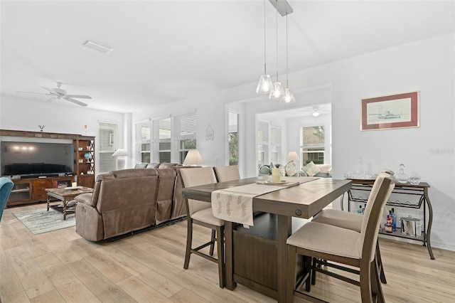 3554 NW 55th Cir, Ocala, FL 34482 - dining room with a ceiling fan and light wood-style flooring