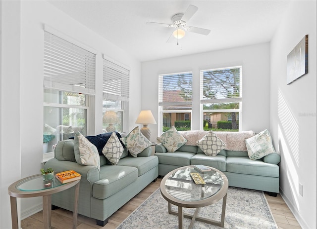 3554 NW 55th Cir, Ocala, FL 34482 - living room featuring plenty of natural light, ceiling fan, and light wood-type flooring