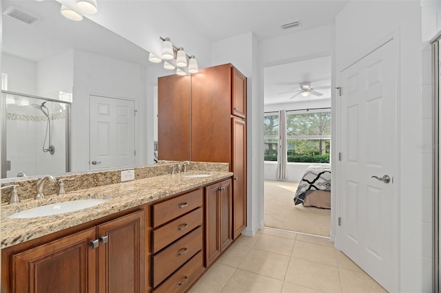3554 NW 55th Cir, Ocala, FL 34482 - ensuite bathroom featuring ceiling fan, a stall shower, tile patterned flooring, and double vanity