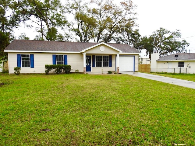 ranch-style house featuring a front yard and a garage