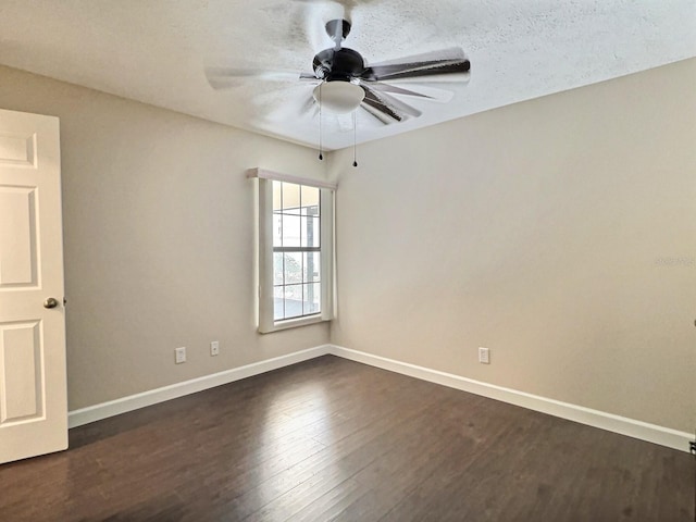 unfurnished room with dark hardwood / wood-style flooring, a textured ceiling, and ceiling fan