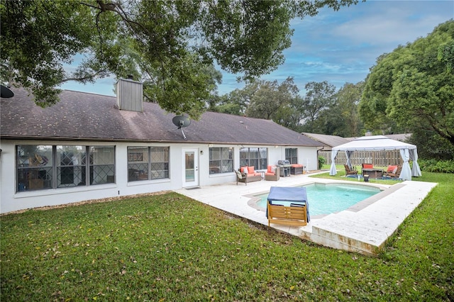 view of swimming pool with a lawn, a patio, a gazebo, and area for grilling