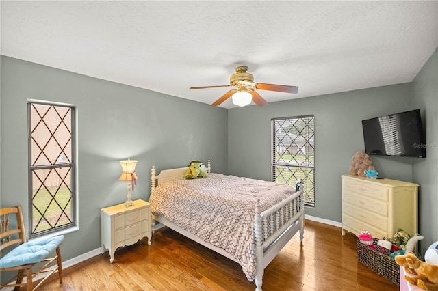 bedroom featuring ceiling fan and light wood-type flooring