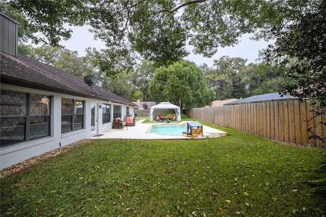 view of yard with a patio and a fenced in pool