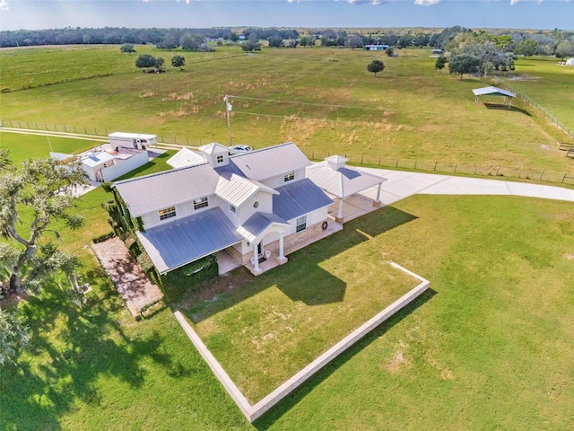 birds eye view of property with a rural view