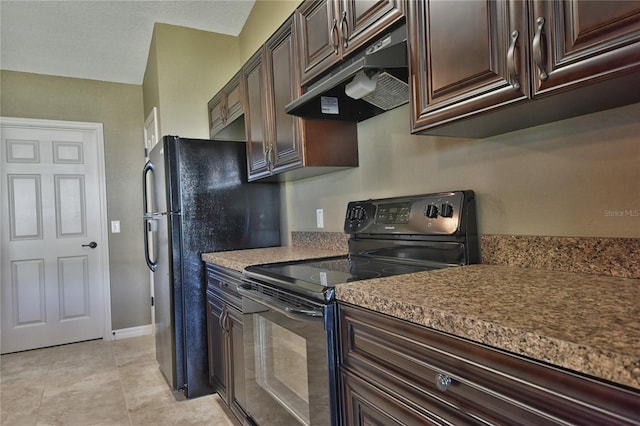 kitchen featuring black electric range oven, dark brown cabinets, and light tile flooring