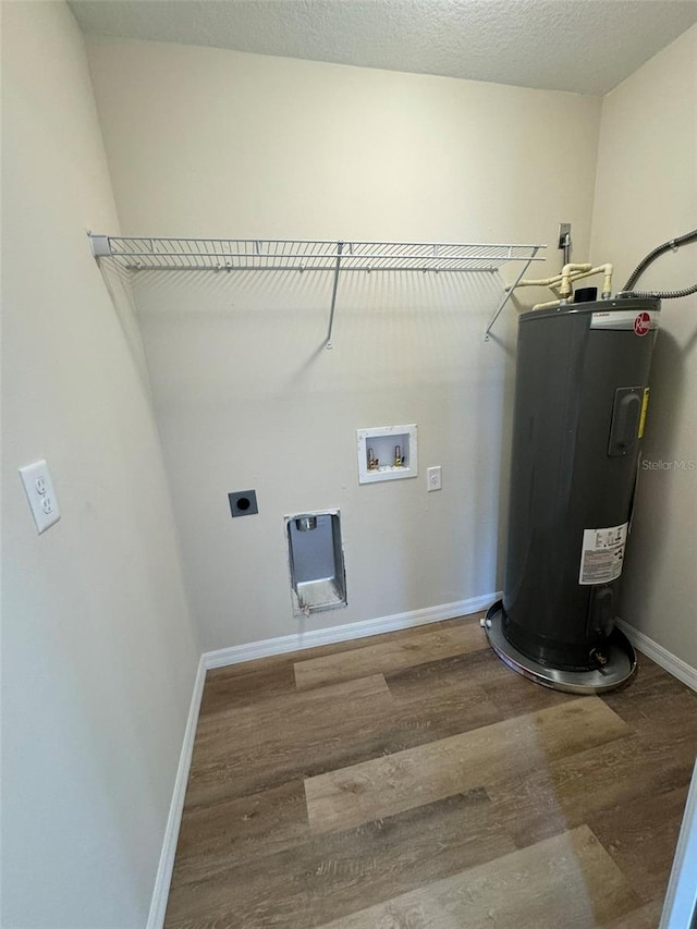 washroom with electric dryer hookup, hookup for a washing machine, wood-type flooring, and water heater