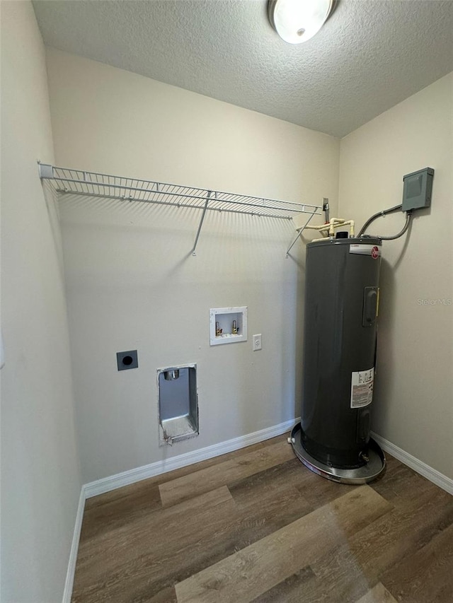 clothes washing area featuring a textured ceiling, electric water heater, electric dryer hookup, hardwood / wood-style flooring, and washer hookup